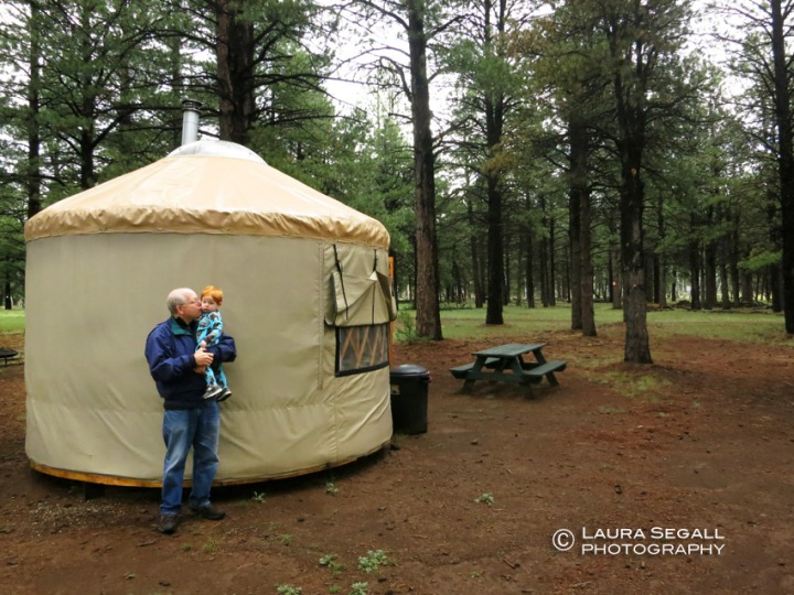 Wyatt and Gramps in front of their yurt at the Nordic Center.